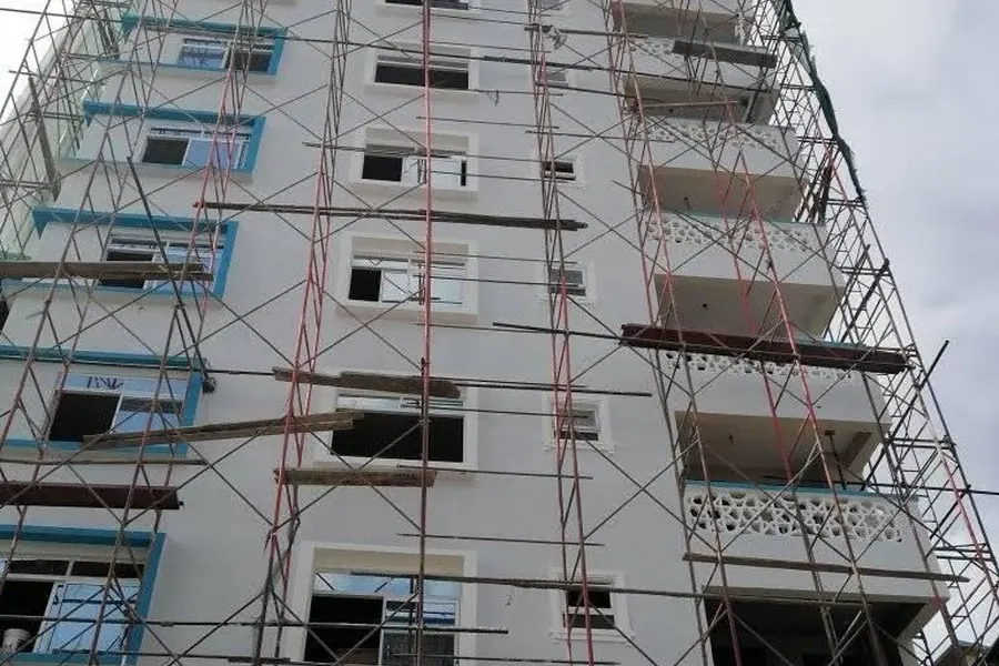 Construction site with concrete formwork and support props