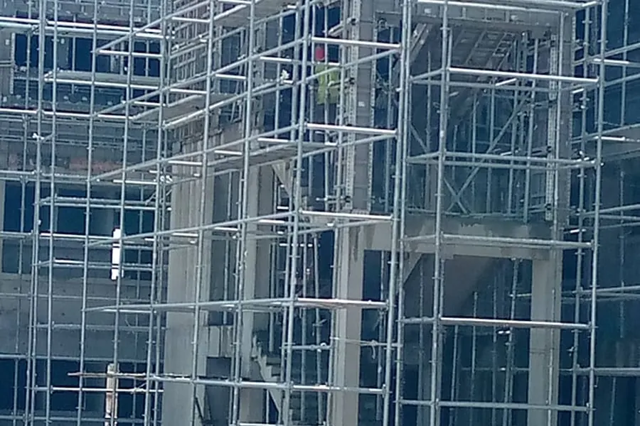 Construction site with concrete formwork and support props
