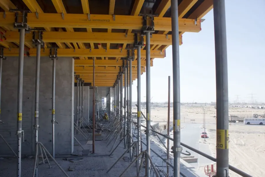 Construction site with concrete formwork and support props