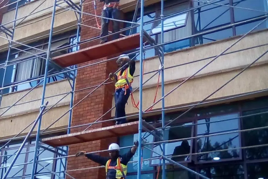 Construction site with concrete formwork and support props